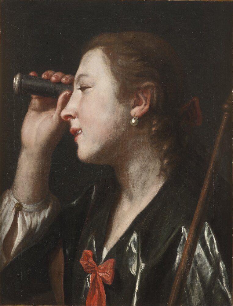 A girl looking through a telescope